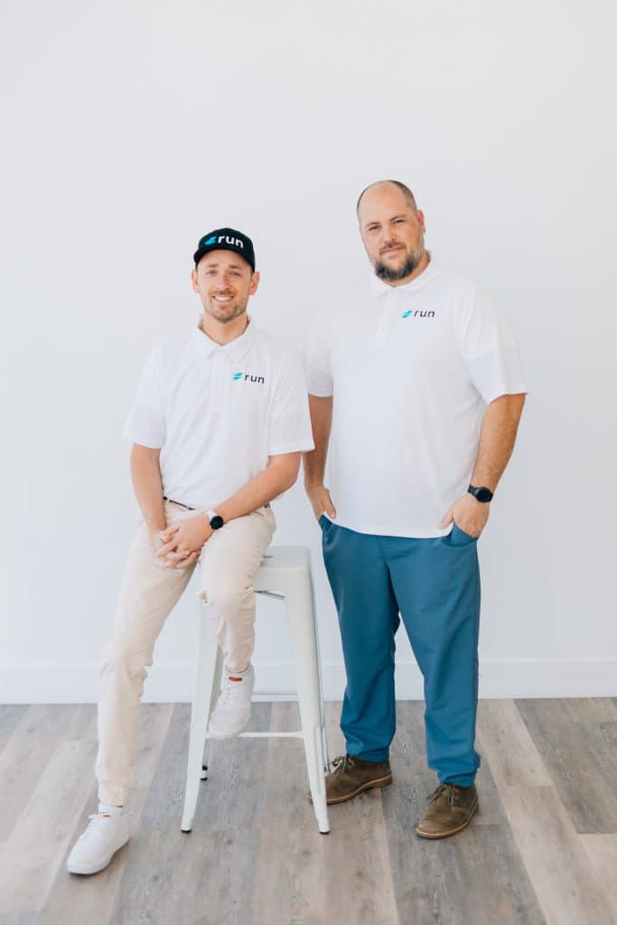 Run Digital lead generation team member in branded apparel, portrait photo.